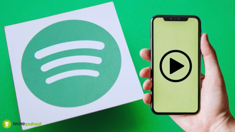 Ascolto musicale Spotify tramite app su smartphone con logo Spotify e pulsante play, evidenziando l'integrazione tecnologica e l'ascolto di musica in mobilità.